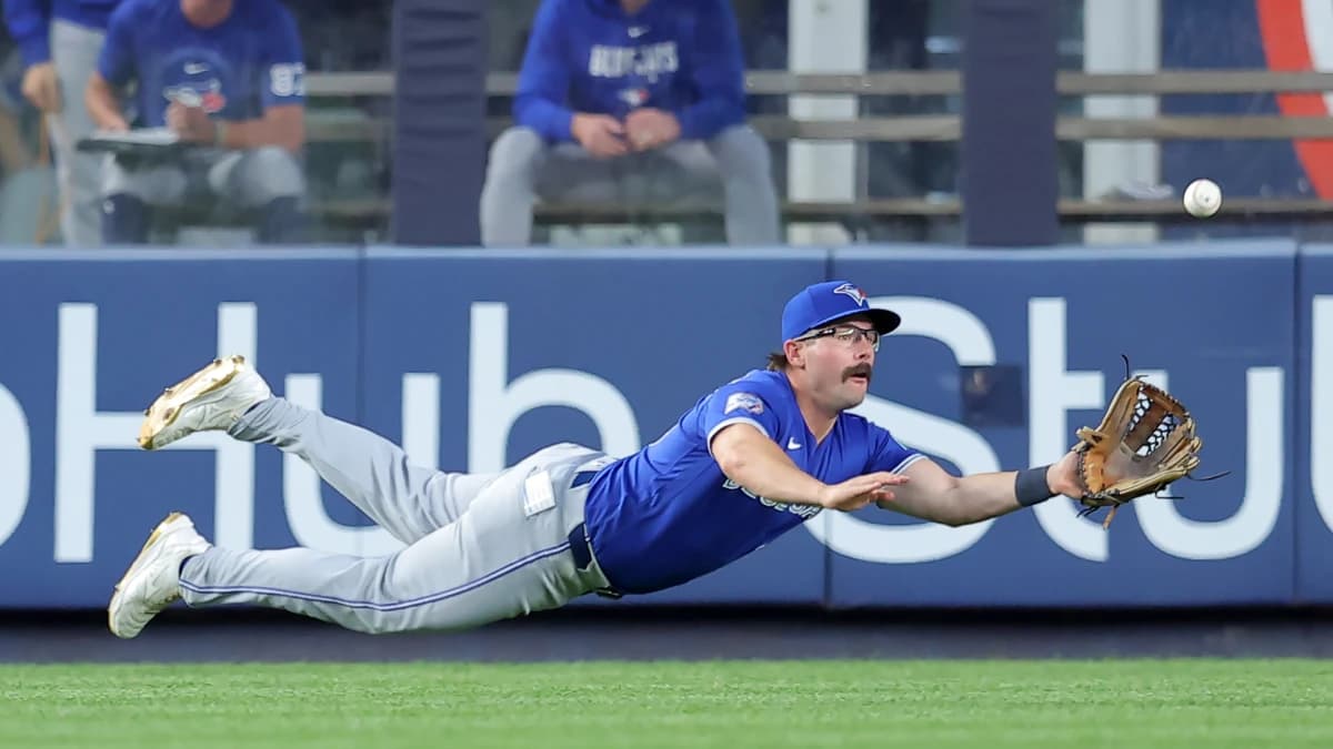 Toronto Blue Jays left fielder Davis Schneider (36) dives but cannot catch a double by New York Yankees shortstop Anthony Volpe (not pictured) during the fourth inning at Yankee Stadium.