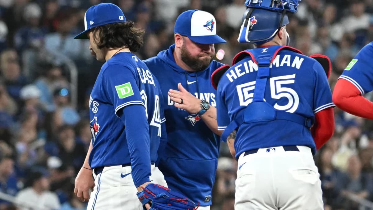 Toronto Blue Jays manager John Schneider (14) relieves starting pitcher Dylan Cease in the sixth inning against the Boston Red Sox at Rogers Centre.