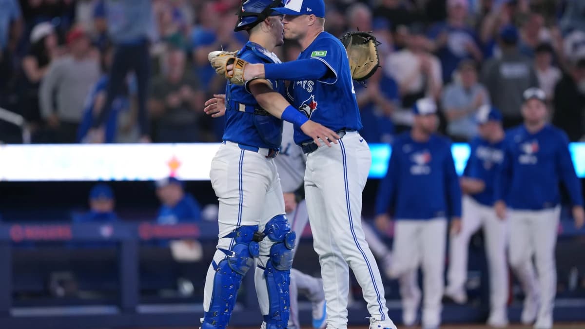 Toronto Blue Jays catcher Brandon Valenzuela (59) celebrates the win with relief pitcher Tanner Andrews (43) against the Miami Marlins at the end of the ninth inning at the Rogers Centre.