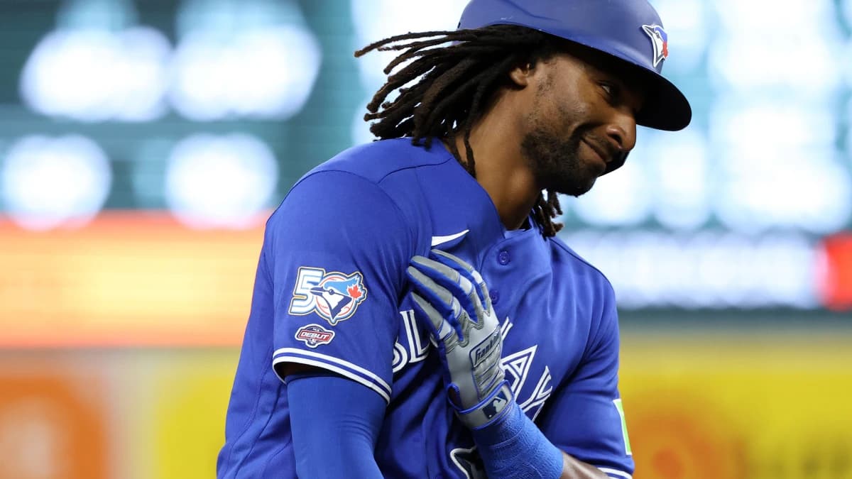 Toronto Blue Jays second baseman Charles McAdoo (26) celebrates after hitting his first career hit/home run during the seventh inning against the Baltimore Orioles at Oriole Park at Camden Yards.