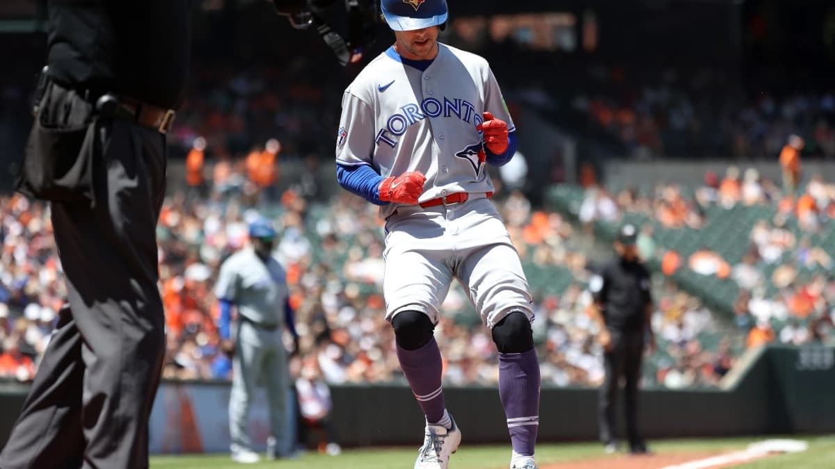 Toronto Blue Jays second baseman Ernie Clement (22) scores a run during the seventh inning against the Baltimore Orioles at Oriole Park at Camden Yards.