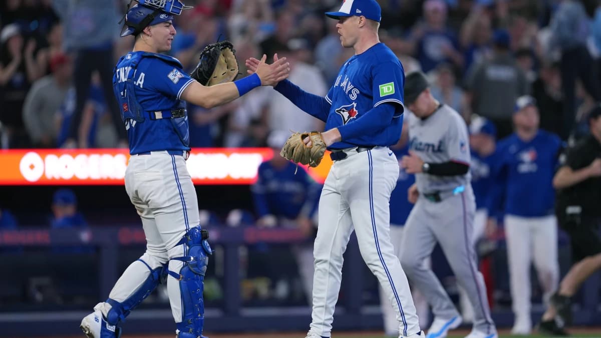 Toronto Blue Jays catcher Brandon Valenzuela (59) celebrates the win with relief pitcher Tanner Andrews (43) against the Miami Marlins at the end of the ninth inning at the Rogers Centre.