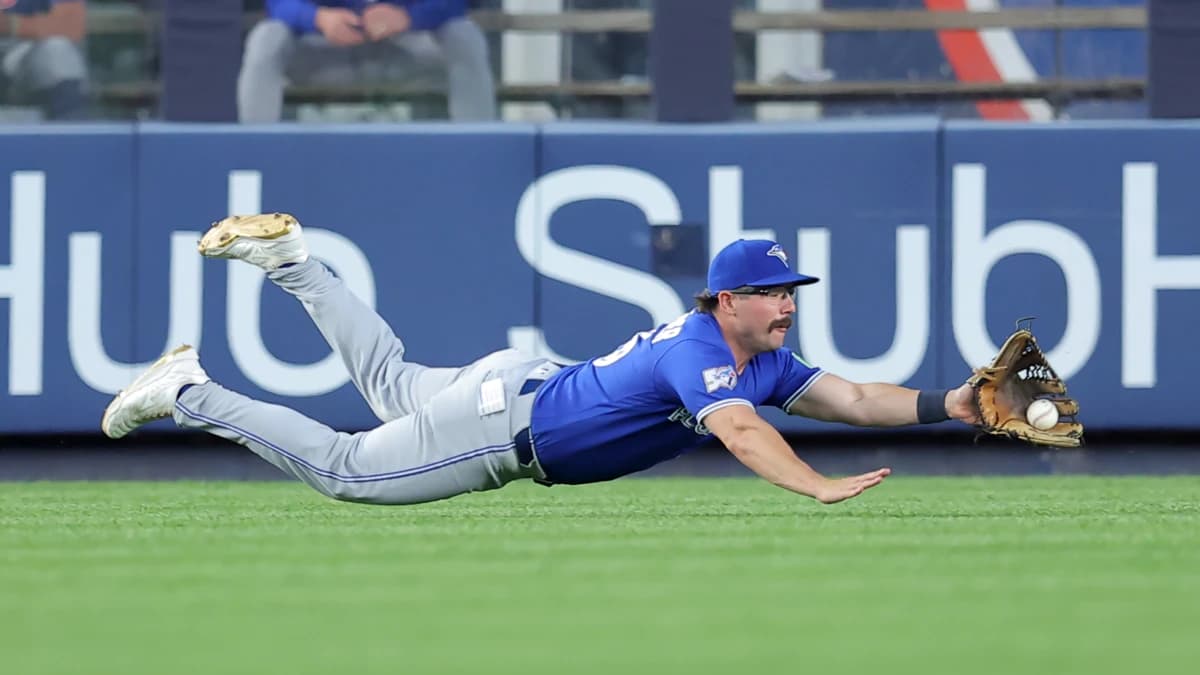 Toronto Blue Jays left fielder Davis Schneider (36) dives but cannot catch a double by New York Yankees shortstop Anthony Volpe (not pictured) during the fourth inning at Yankee Stadium.