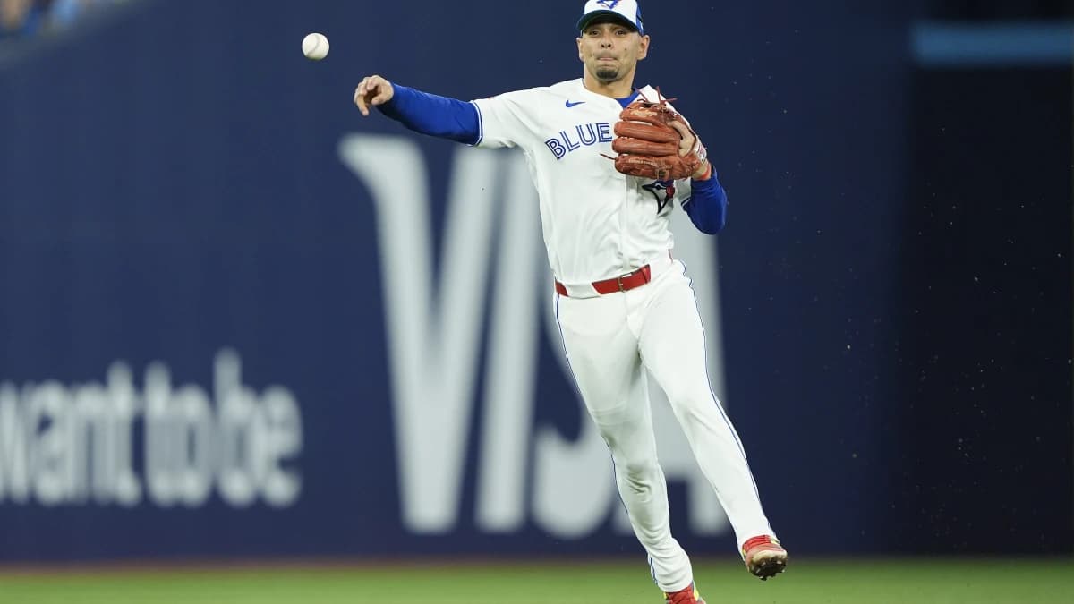 Toronto Blue Jays shortstop Andres Gimenez (0) throws out Philadelphia Phillies shortstop Trea Turner (not pictured) at first base during the third inning at Rogers Centre.