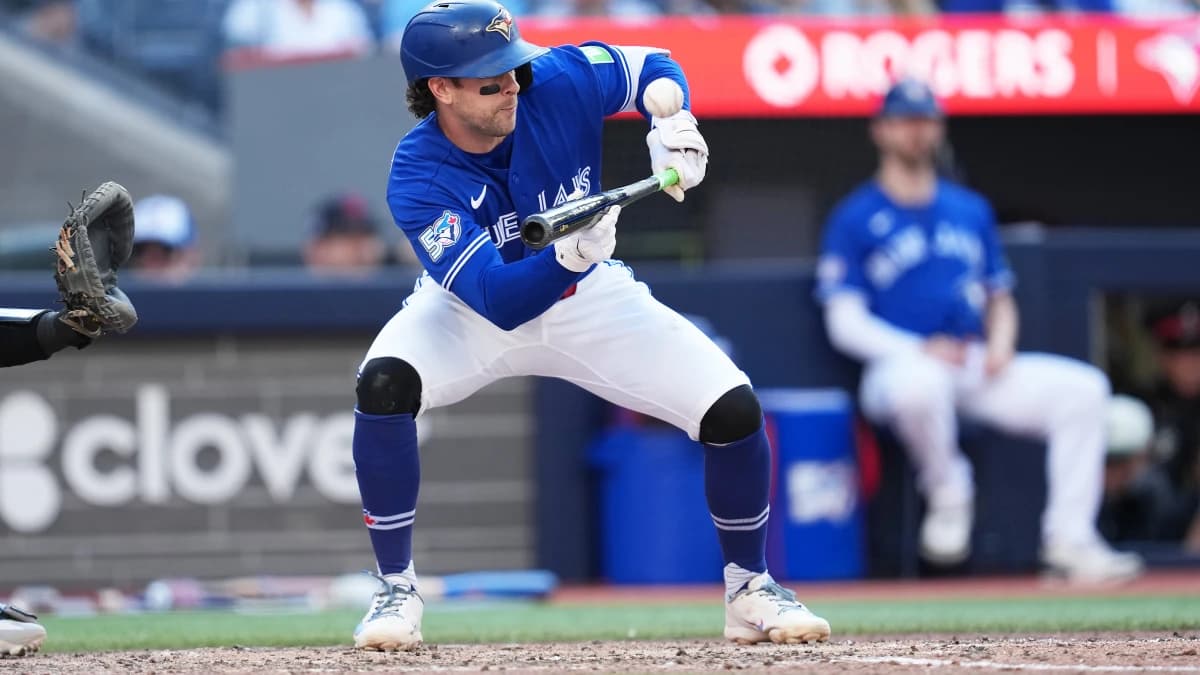 Toronto Blue Jays second baseman Ernie Clement (22) attempts a bunt and pops out against the New York Yankees during the eighth inning at Rogers Centre.