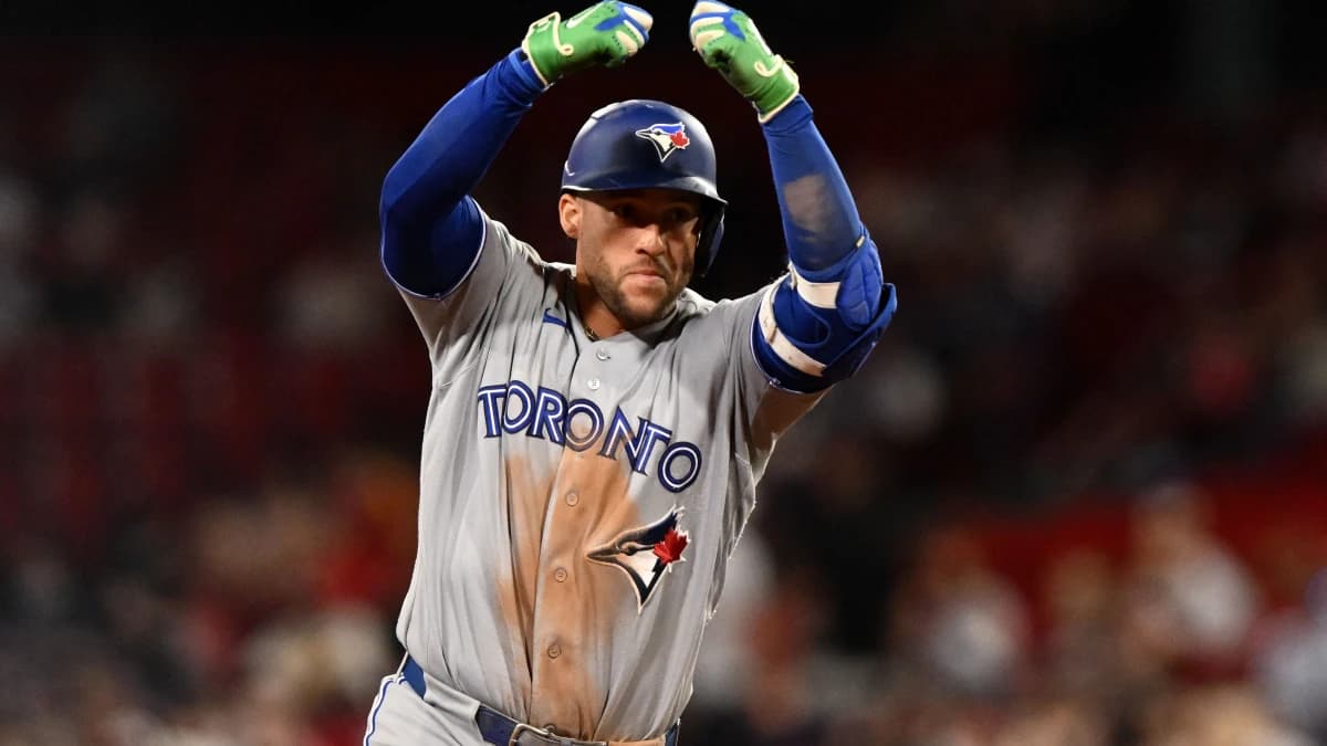 Toronto Blue Jays designated hitter George Springer (4) reacts after hitting a home run against the Boston Red Sox during the ninth inning at Fenway Park.