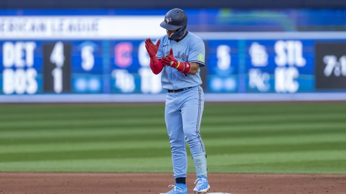 Toronto Blue Jays second baseman Santiago Espinal (5) celebrates after hitting a double against the Chicago Cubs during the sixth inning at Rogers Centre.