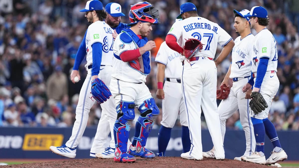 Toronto Blue Jays starting pitcher Dylan Cease (84) is relieved by manager John Schneider (14) against the Houston Astros during the sixth inning at Rogers Centre.