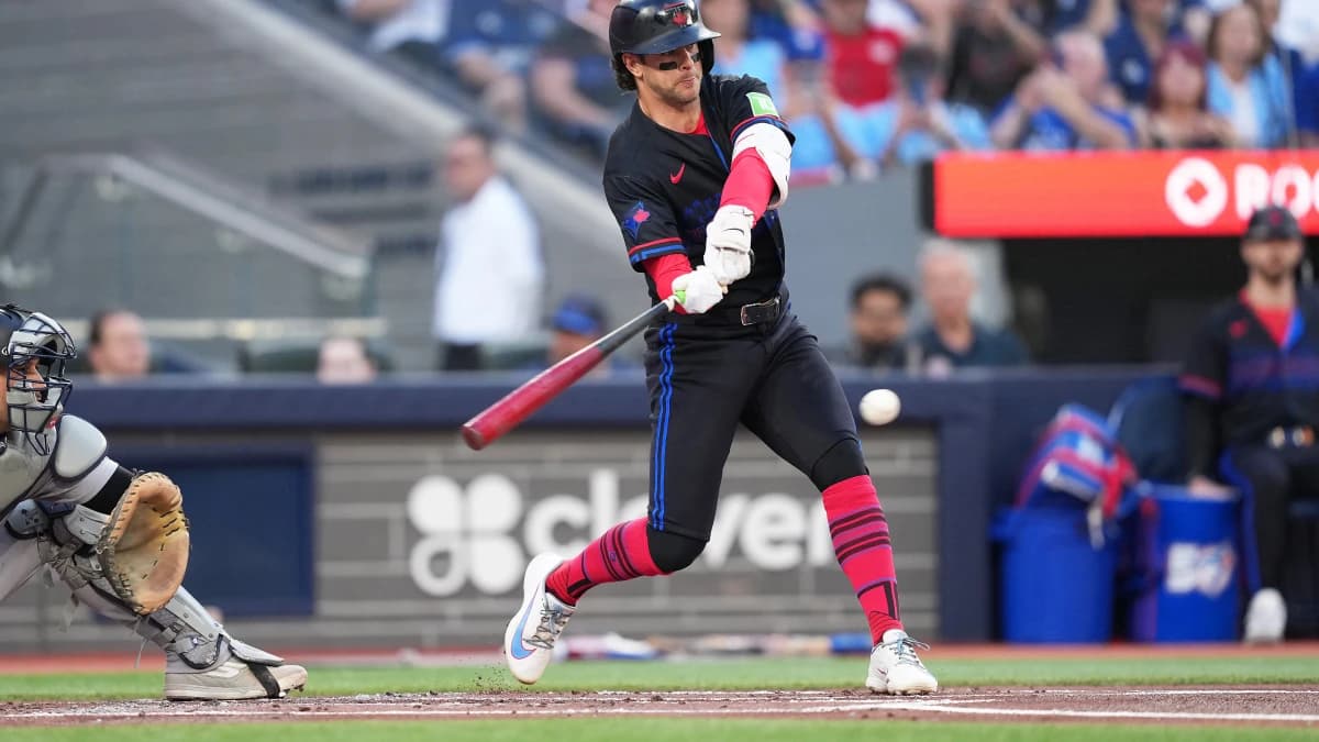 Toronto Blue Jays second baseman Ernie Clement (22) hits an in field single against the New York Yankees during the first inning at Rogers Centre.