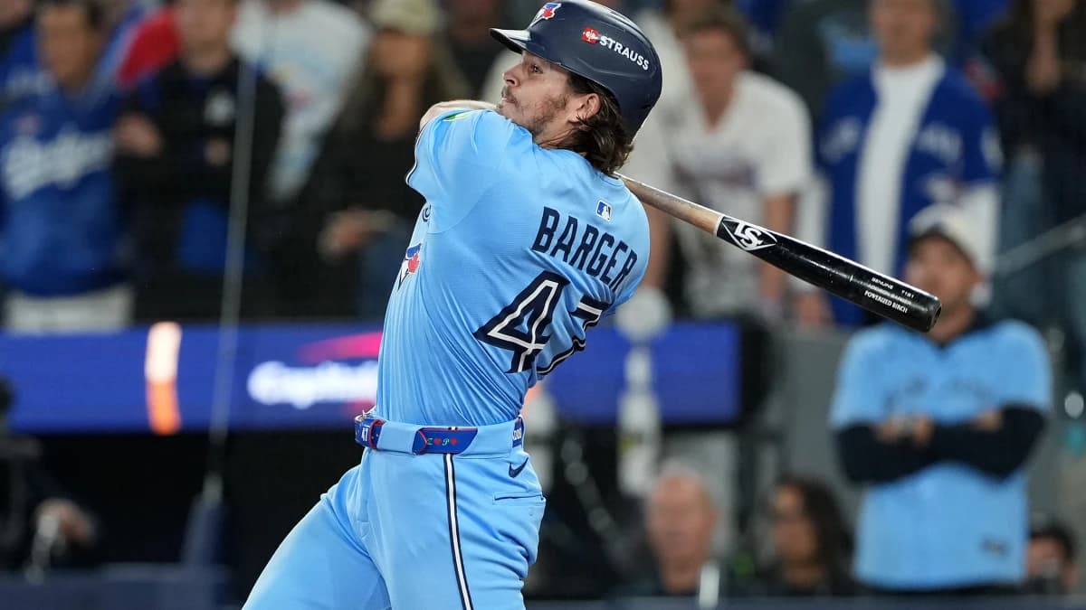Toronto Blue Jays third baseman Addison Barger (47) hits a double against the Los Angeles Dodgers in the ninth inning for game six of the 2025 MLB World Series at Rogers Centre.