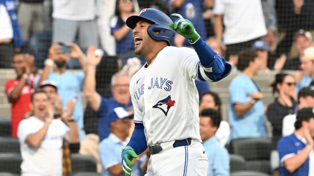 Toronto Blue Jays designated hitter George Springer (4) reacts after scoring a run on a triple and an error against the New York Mets in the first inning at Rogers Centre.