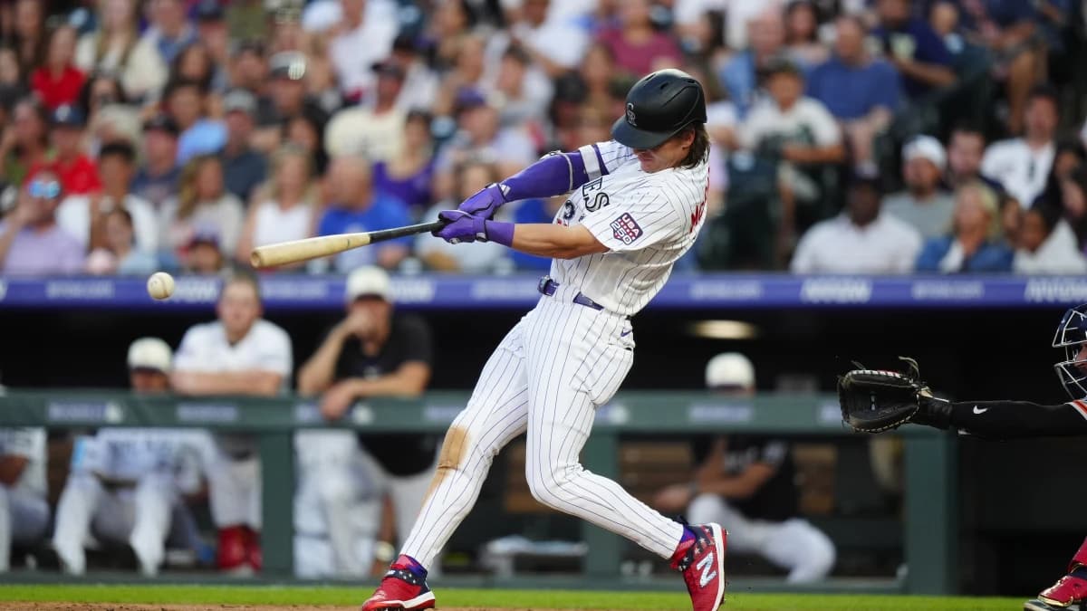 Colorado Rockies left fielder Jake McCarthy (31) swings the bat in the fourth inning against the San Francisco Giants at Coors Field.