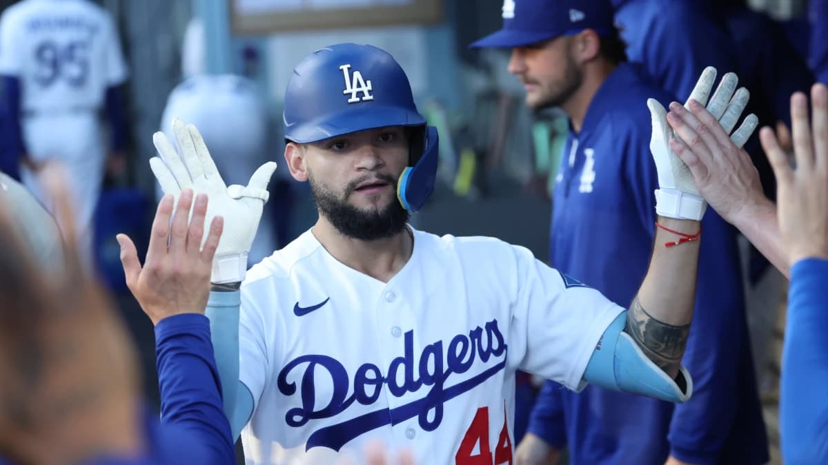 Los Angeles Dodgers center fielder Andy Pages (44) high-fives teammates after hitting a home run during the first inning against the Arizona Diamondbacks at Dodger Stadium.