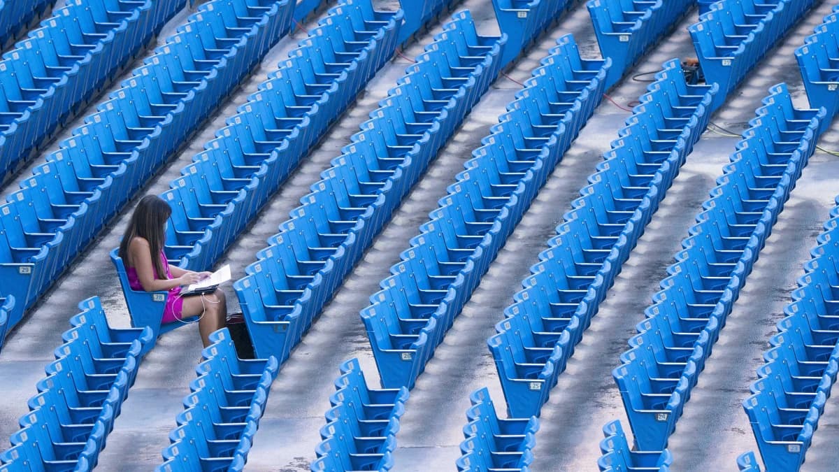 Canadian sportscaster Hazel Mae sits in the stands during the Toronto Blue Jays Workout at Rogers Centre.