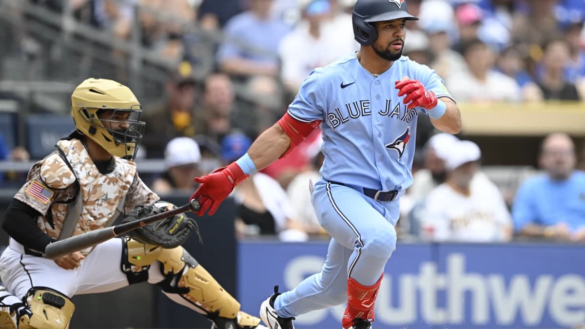 Toronto Blue Jays left fielder Jonatan Clase (8) hits a single during the second inning against the San Diego Padres at Petco Park.