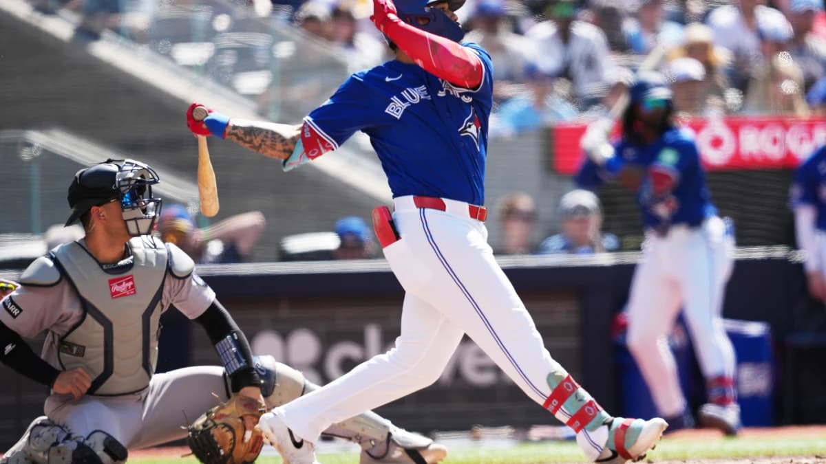 Toronto Blue Jays right fielder Yohendrick Pinango (24) hits a double against the New York Yankees during the fourth inning at Rogers Centre.