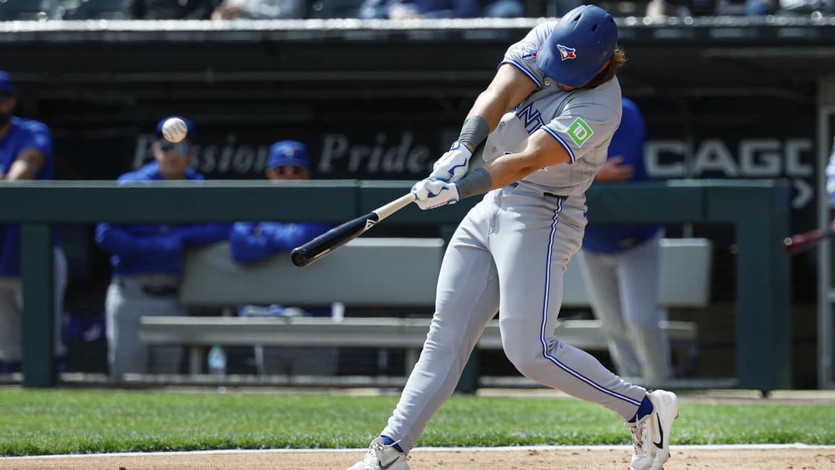 Toronto Blue Jays right fielder Addison Barger (47) hits a double against the Chicago White Sox during the second inning at Rate Field.