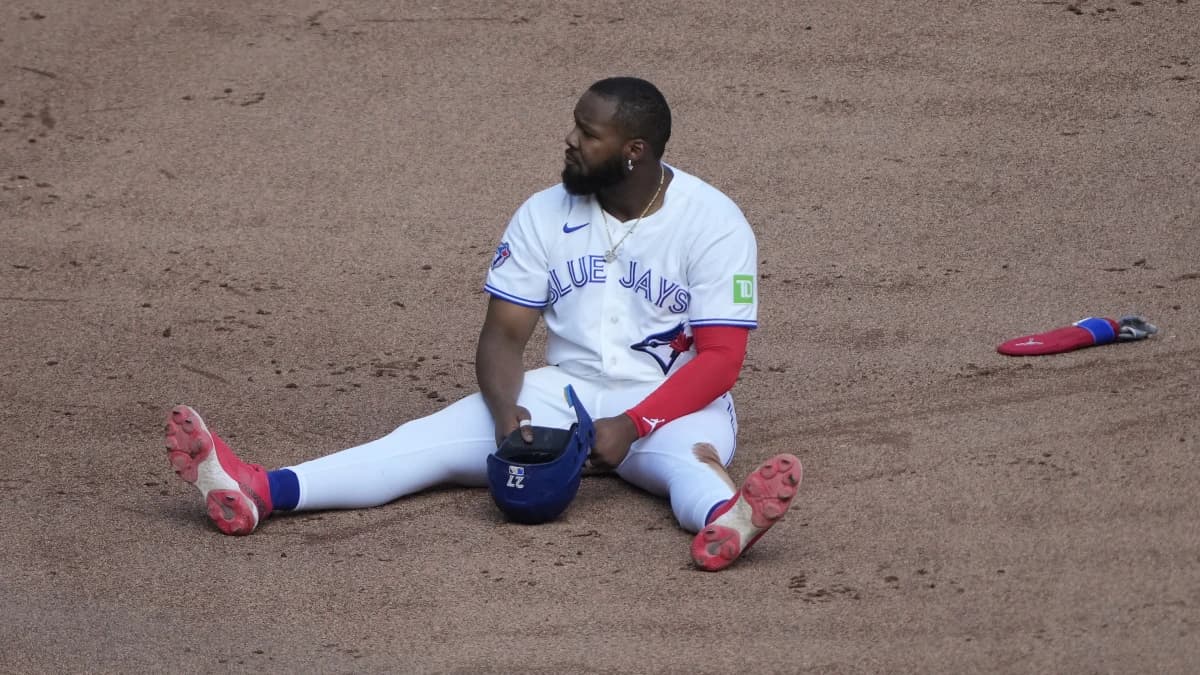 Toronto Blue Jays first baseman Vladimir Guerrero Jr. (27) sits on the infield after caught trying to steal second base by Tampa Bay Rays second baseman Richard Palacios (not pictured) during the seventh inning at Rogers Centre.