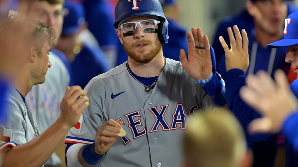 Texas Rangers catcher Danny Jansen (9) in the dugout after a solo home run in the ninth inning against the Los Angeles Angels at Angel Stadium.