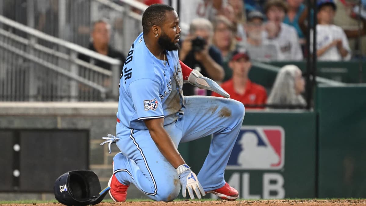 Toronto Blue Jays first baseman Vladimir Guerrero Jr. (27) kneels after being thrown out at home against the Washington Nationals during the fifth inning at Nationals Park.