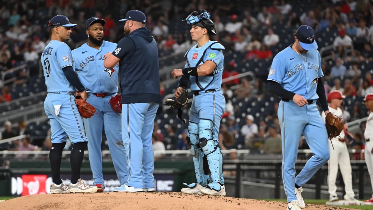 Toronto Blue Jays pitcher Shane Bieber (57) is removed from the game during the first inning by manager John Schneider (14) against the Washington Nationals at Nationals Park.
