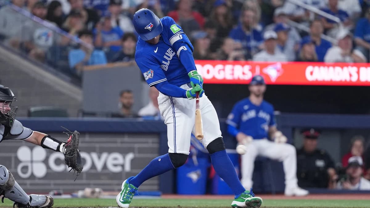 Toronto Blue Jays designated hitter George Springer (4) hits an RBI single against the Chicago White Sox during the fourth inning at Rogers Centre
