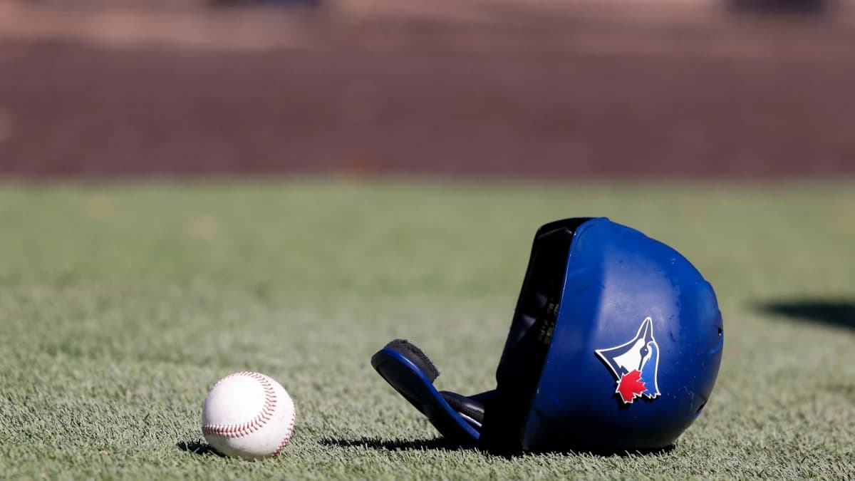 Toronto Blue Jays batting helmet lays on the ground during workouts at Toronto Blue Jays Player Development Complex