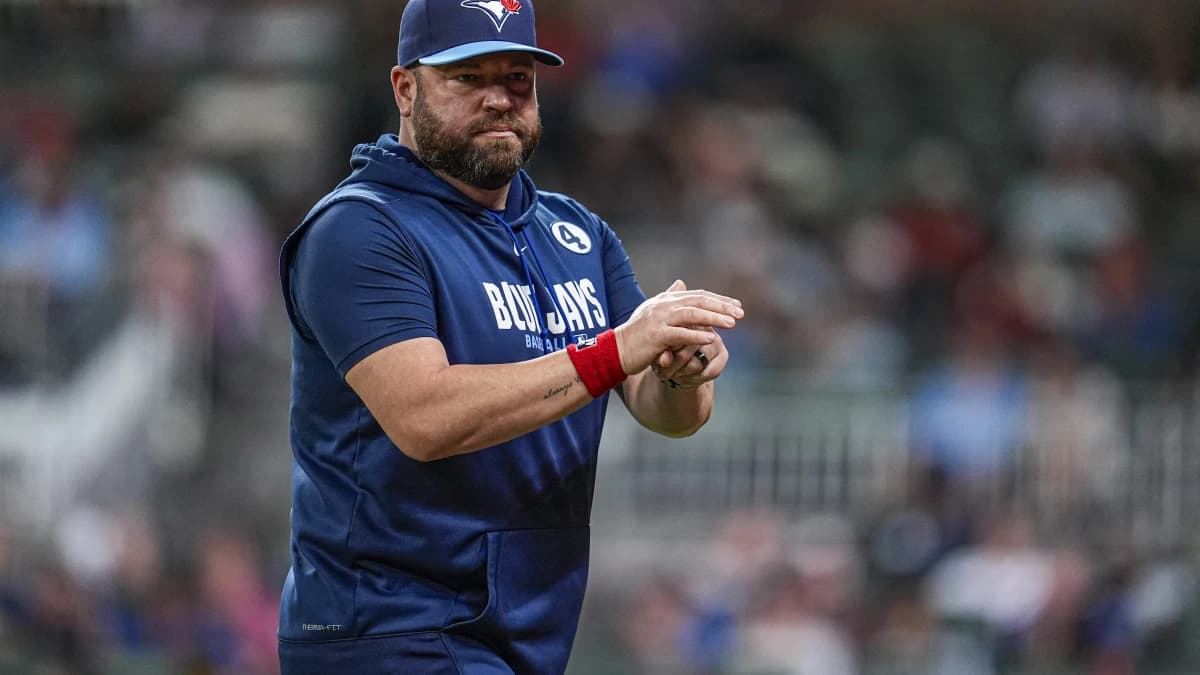 Toronto Blue Jays manager John Schneider (14) on the field against the Atlanta Braves during the eighth inning at Truist Park.
