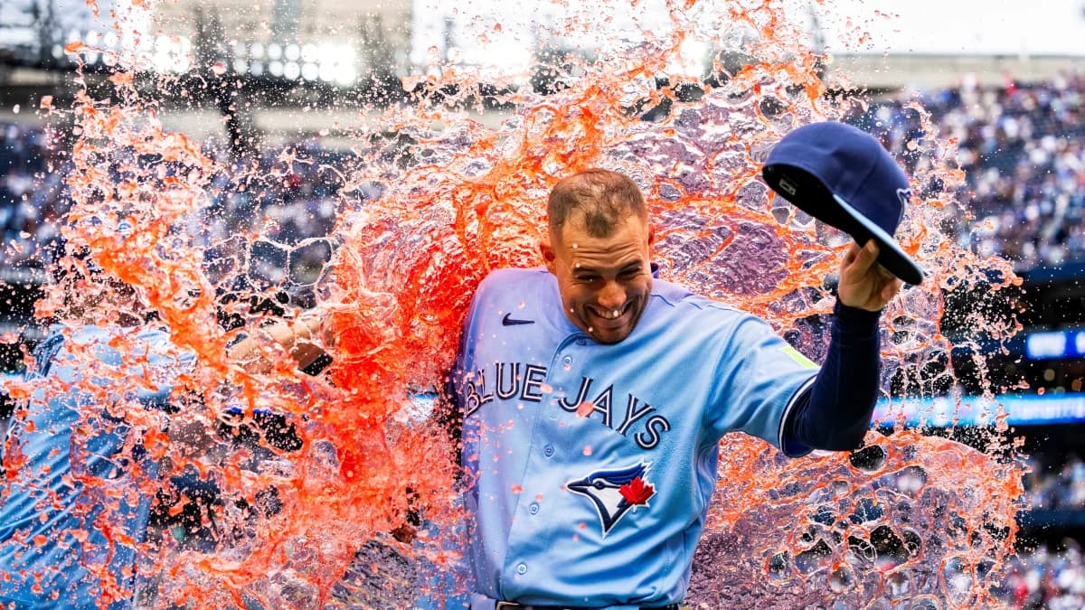 Toronto Blue Jays designated hitter George Springer (4) has orange liquid dumped on him after defeating the St. Louis Cardinals at Rogers Centre