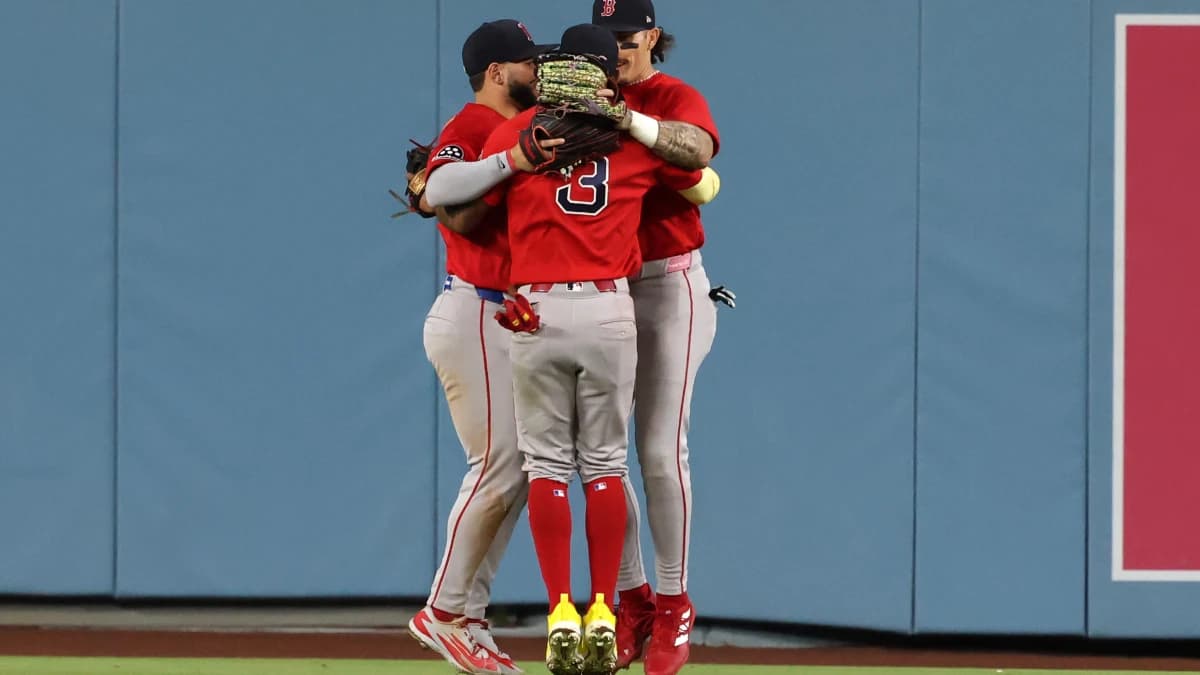 Boston Red Sox center fielder Ceddanne Rafaela (3) celebrates a win with right fielder Wilyer Abreu (52) and left fielder Jarren Duran (16) after defeating the Los Angeles Dodgers 9-4 at Dodger Stadium.