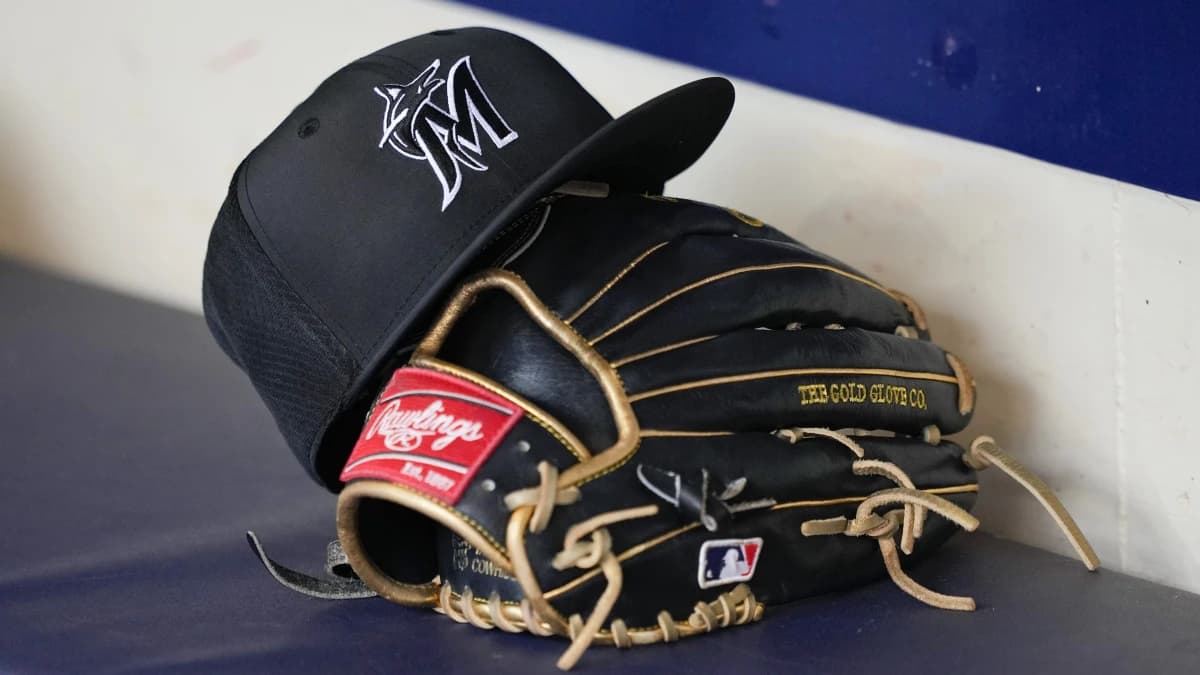 General view of a Miami Marlins hat and glove prior to the game against the Milwaukee Brewers at American Family Field