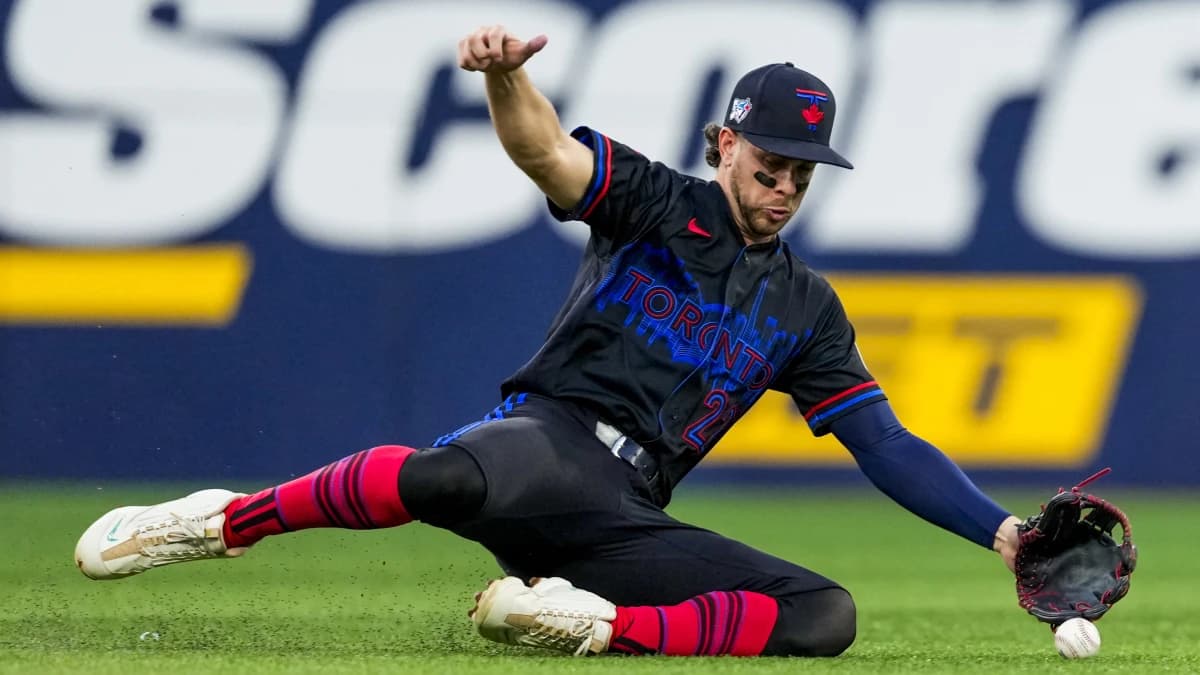 Toronto Blue Jays second baseman Ernie Clement (22) attempts to field the ball against the St. Louis Cardinals during the fifth inning at Rogers Centre