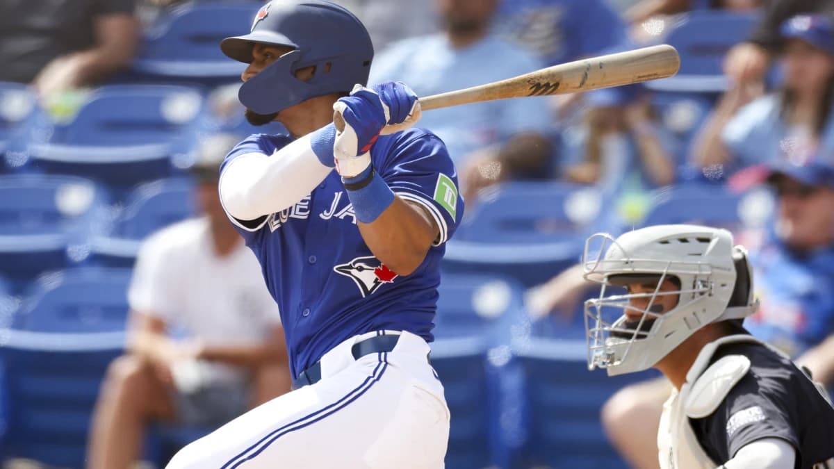 Toronto Blue Jays second baseman Santiago Espinal (5) hits a two rbi double against the New York Yankees in the fifth inning at TD Ballpark.