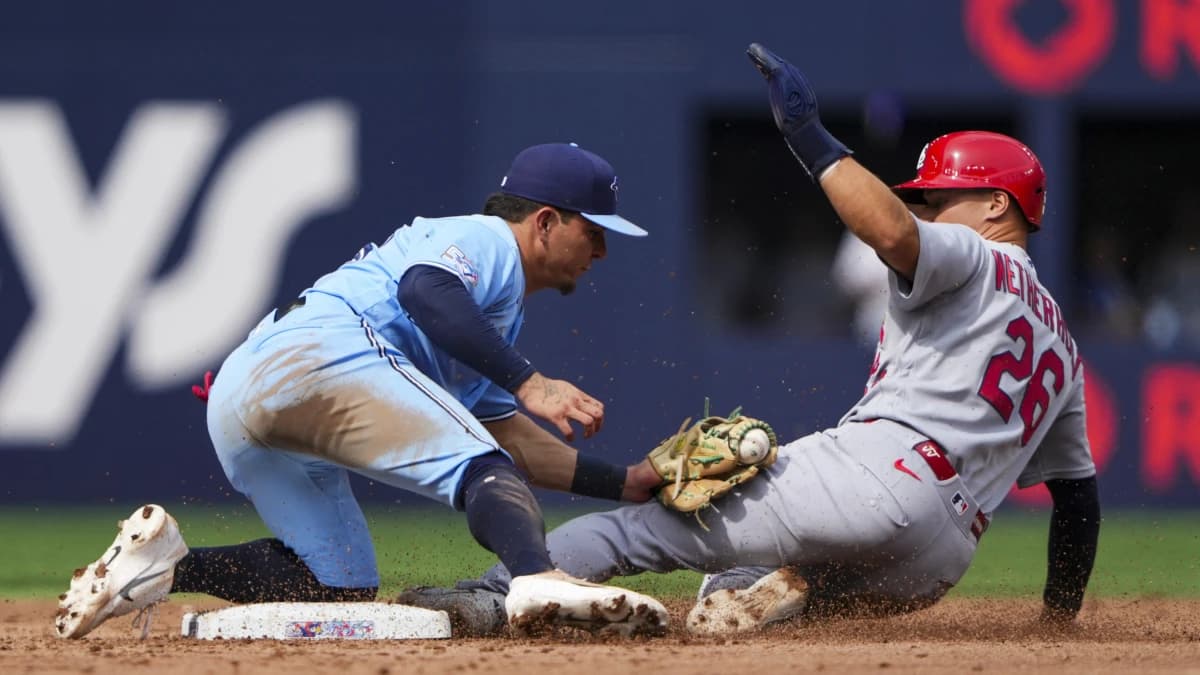 Toronto Blue Jays second baseman Luis Urías (48) tags out St. Louis Cardinals second baseman JJ Wetherholt (26) during the fifth inning at second base at Rogers Centre.