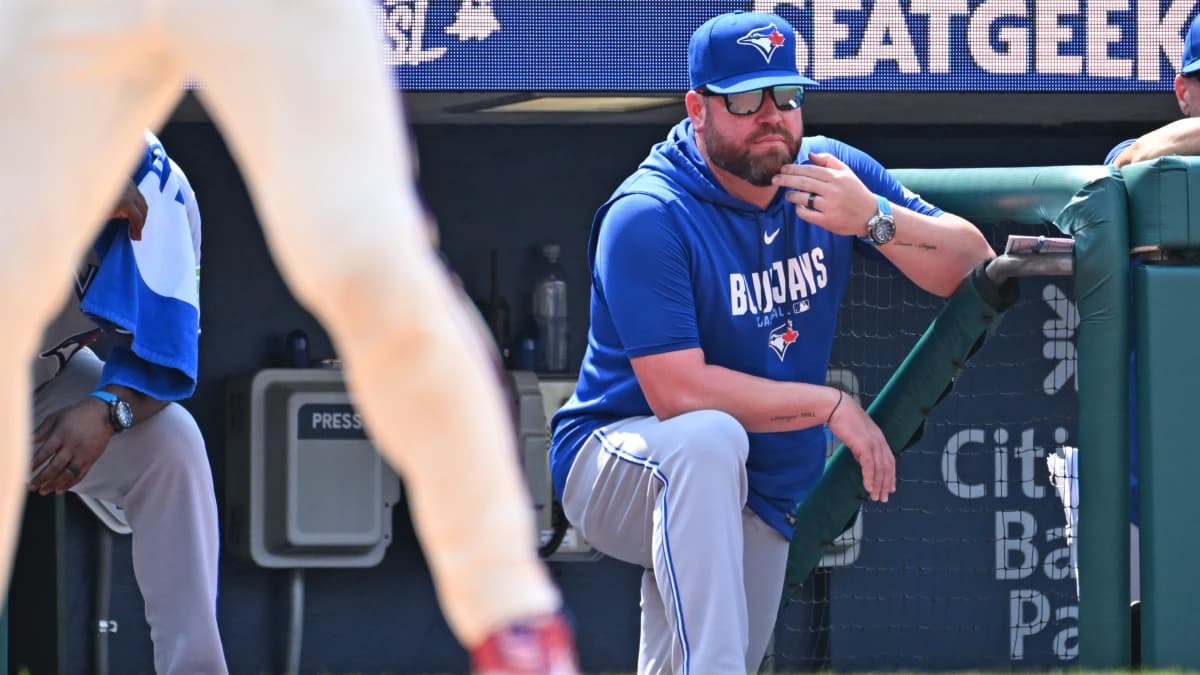 Toronto Blue Jays manager John Schneider (14) looks on from the dugout against the Philadelphia Phillies during the sixth inning at Citizens Bank Park.