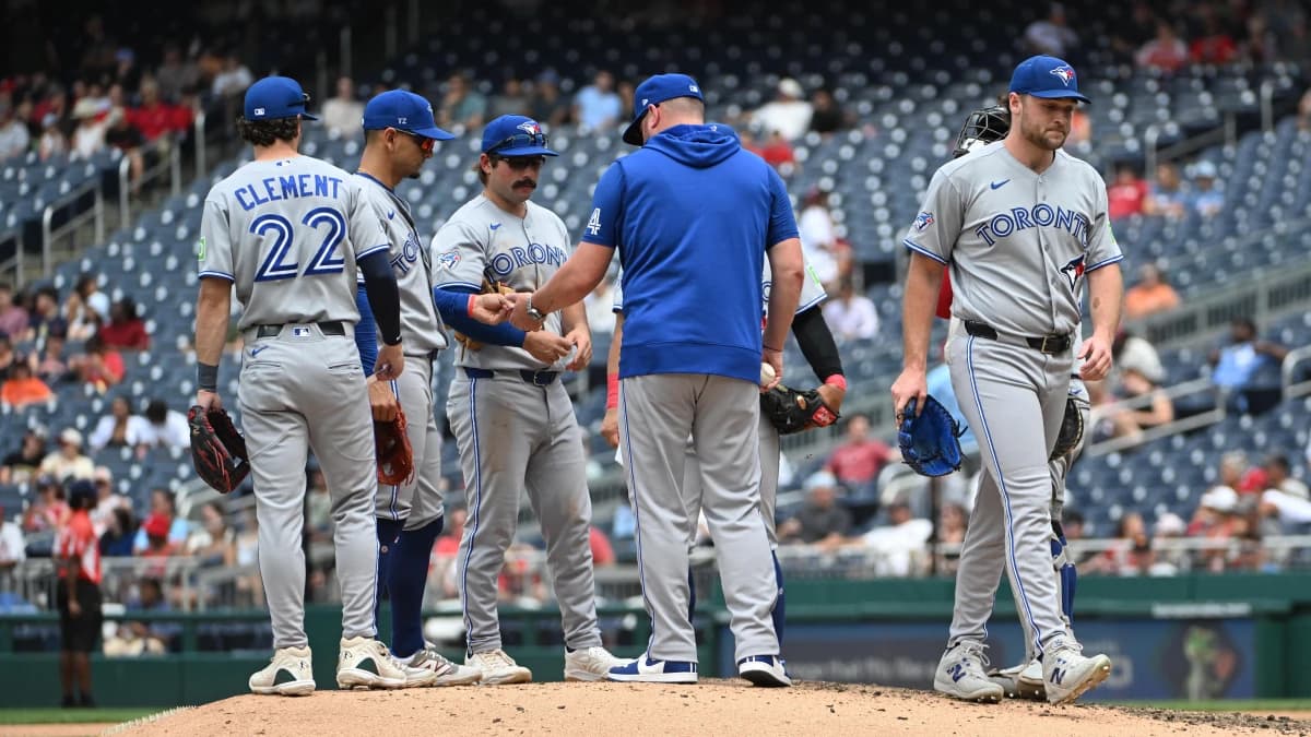 Toronto Blue Jays manager John Schneider (14) removes pitcher Trey Yesavage (39) from the game against the Washington Nationals during the seventh inning at Nationals Park.