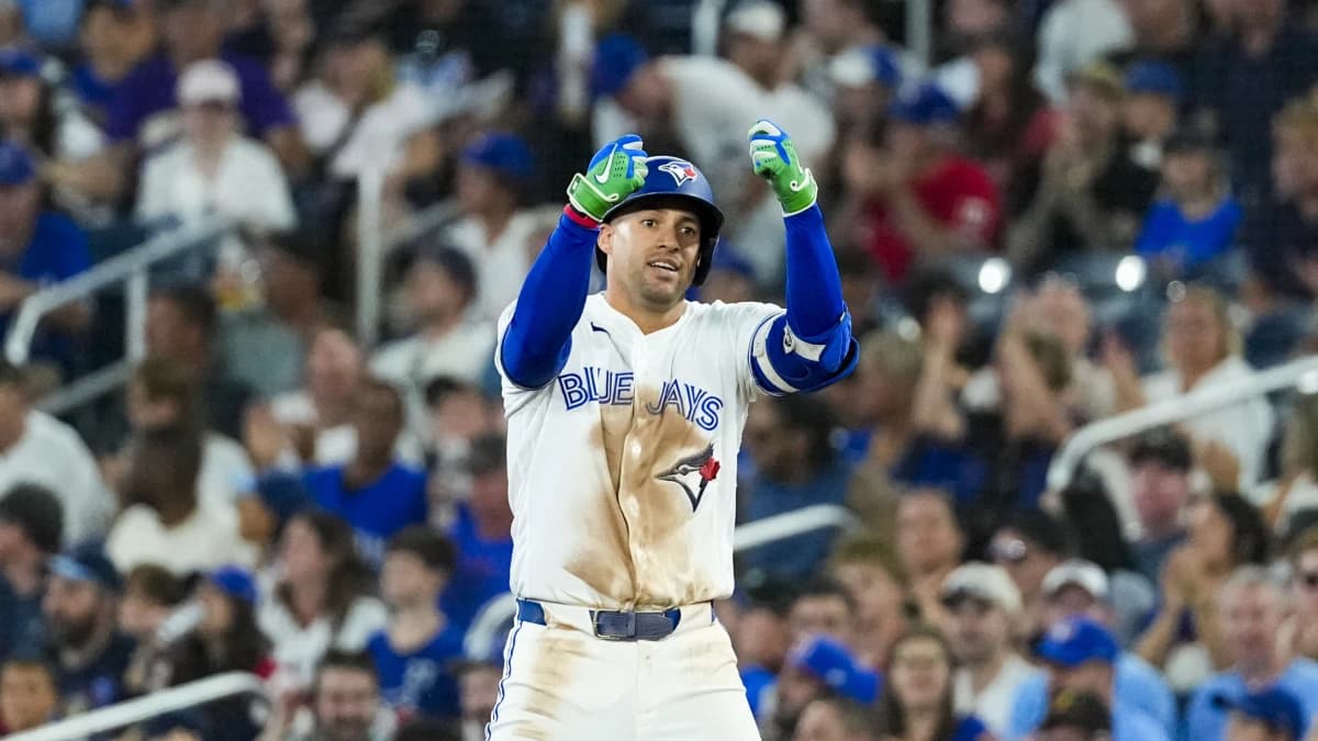 Toronto Blue Jays designated hitter George Springer (4) celebrates hitting a single against the Boston Red Sox during the eighth inning at Rogers Centre