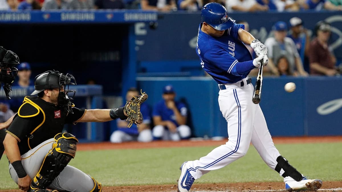 Toronto Blue Jays second baseman Rob Refsnyder (39) hits a single during the 6th inning against the Pittsburgh Pirates at the Rogers Centre. The Toronto Blue Jays beat the Pittsburgh Pirates 7-2.