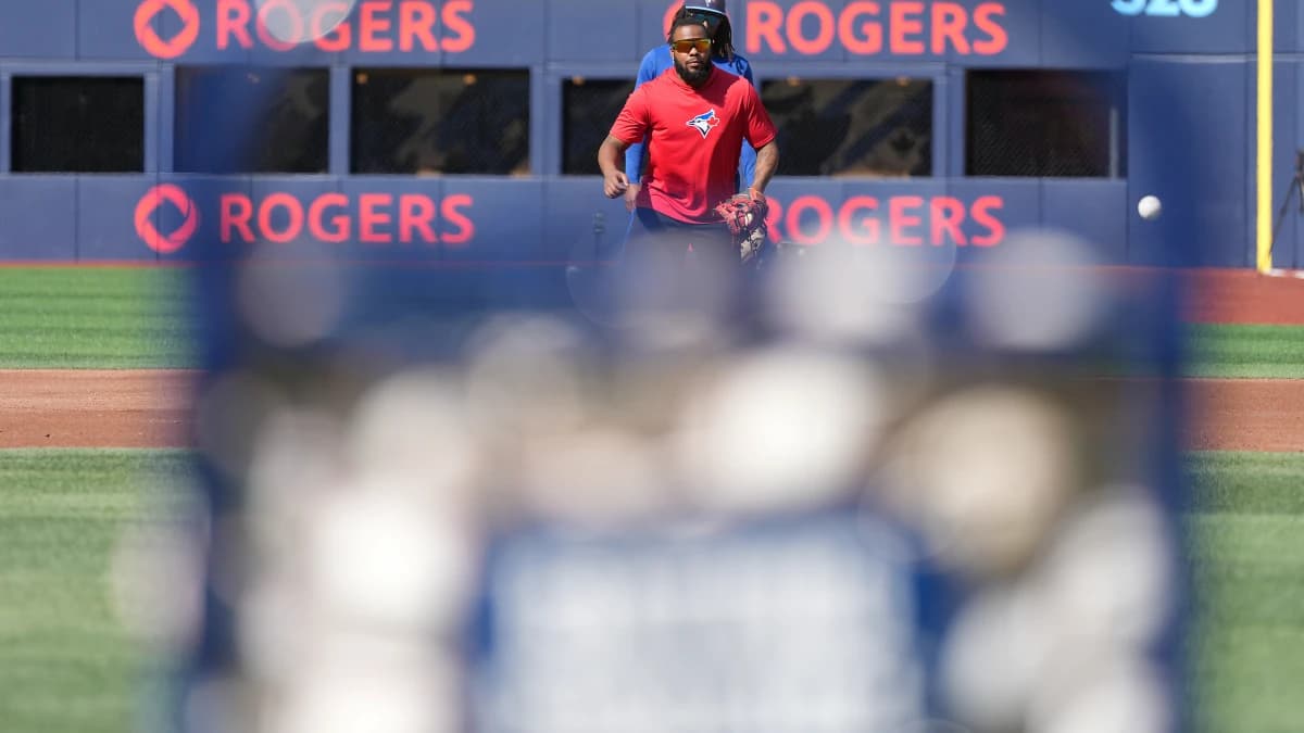 Toronto Blue Jays first baseman Vladimir Guerrero Jr. (27) fields balls during batting practice before a game against the New York Yankees at Rogers Centre.