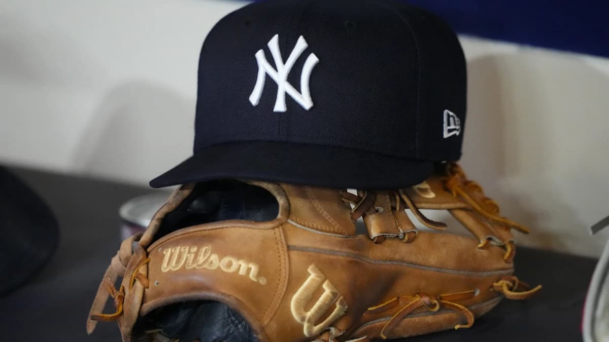 General view of a New York Yankees hat and glove prior to the game against the Milwaukee Brewers at American Family Field.