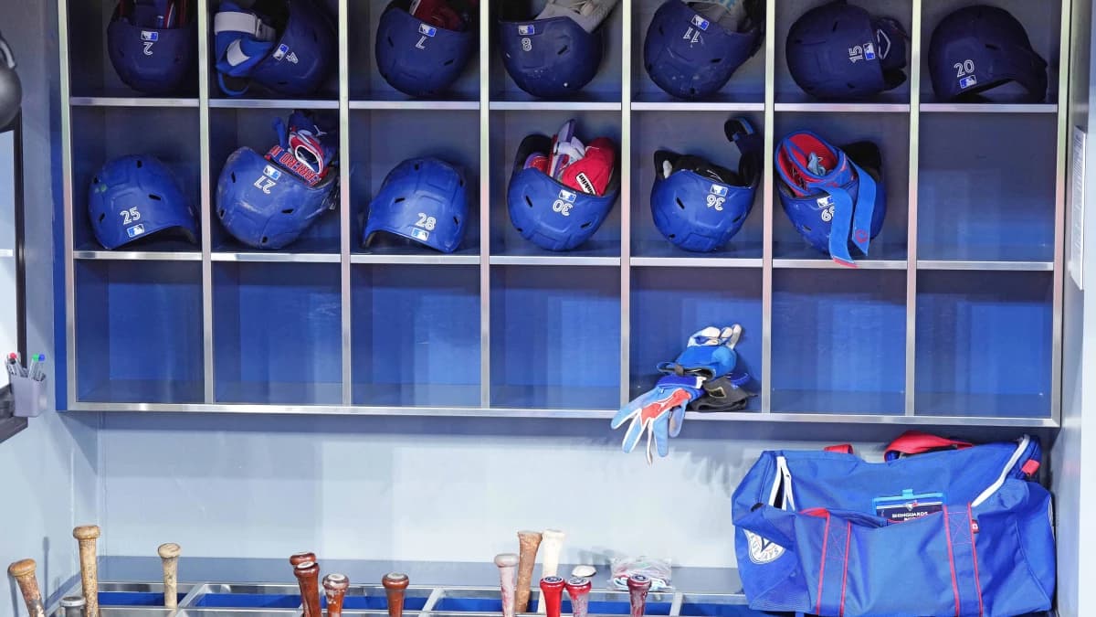 The Toronto Blue Jays Batting helmets and bats sit in the dugout during batting practice before a game against the Colorado Rockies at Rogers Centre.