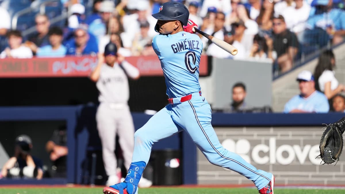 Toronto Blue Jays shortstop Andrés Giménez (0) hits a single against the New York Yankees during the eighth inning at Rogers Centre.