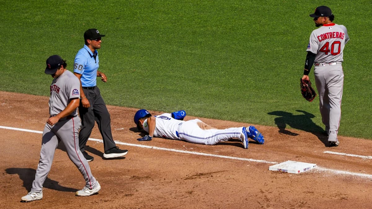 Toronto Blue Jays shortstop Andrés Giménez (0) lays on the infield after being called out at first base during the fifth inning at Rogers Centre.