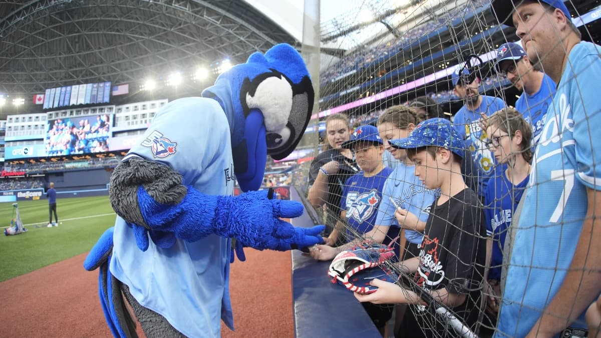 The Toronto Blue Jays mascot "Ace" interacts with fans before their game against the Kansas City Royals at Rogers Centre.