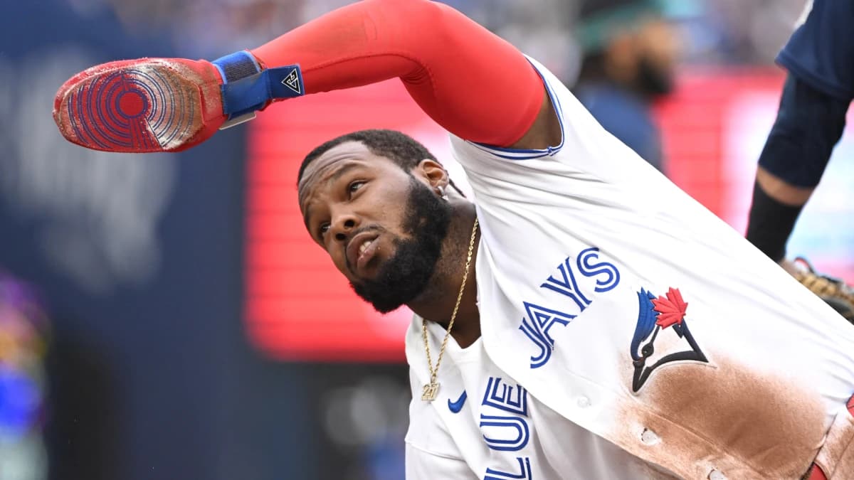 Toronto Blue Jays first baseman Vladimir Guerrero Jr. (27) ask for time after sliding safely into third base against the Seattle Mariners in the fifth inning at Rogers Centre.
