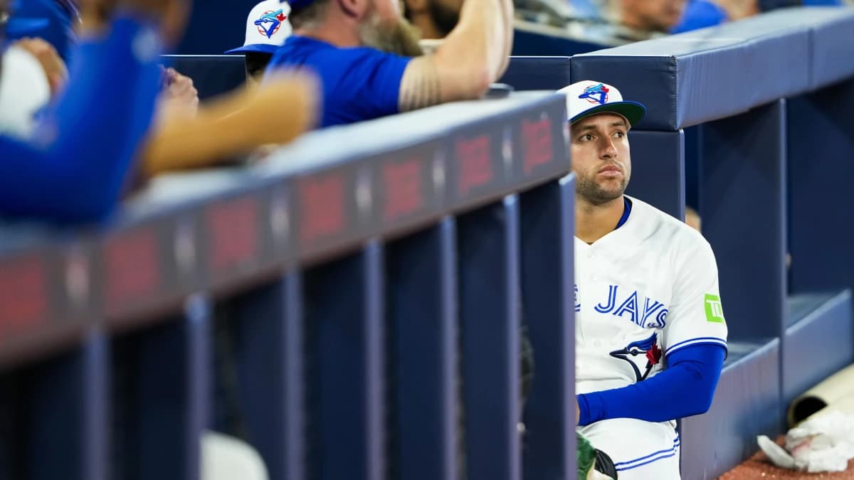 Toronto Blue Jays designated hitter George Springer (4) sits outside the dugout during a pregame celebration before playing the Seattle Mariners at Rogers Centre