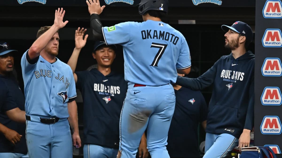 Toronto Blue Jays third baseman Kazuma Okamoto (7) celebrates after scoring during the fifth inning against the Cleveland Guardians at Progressive Field