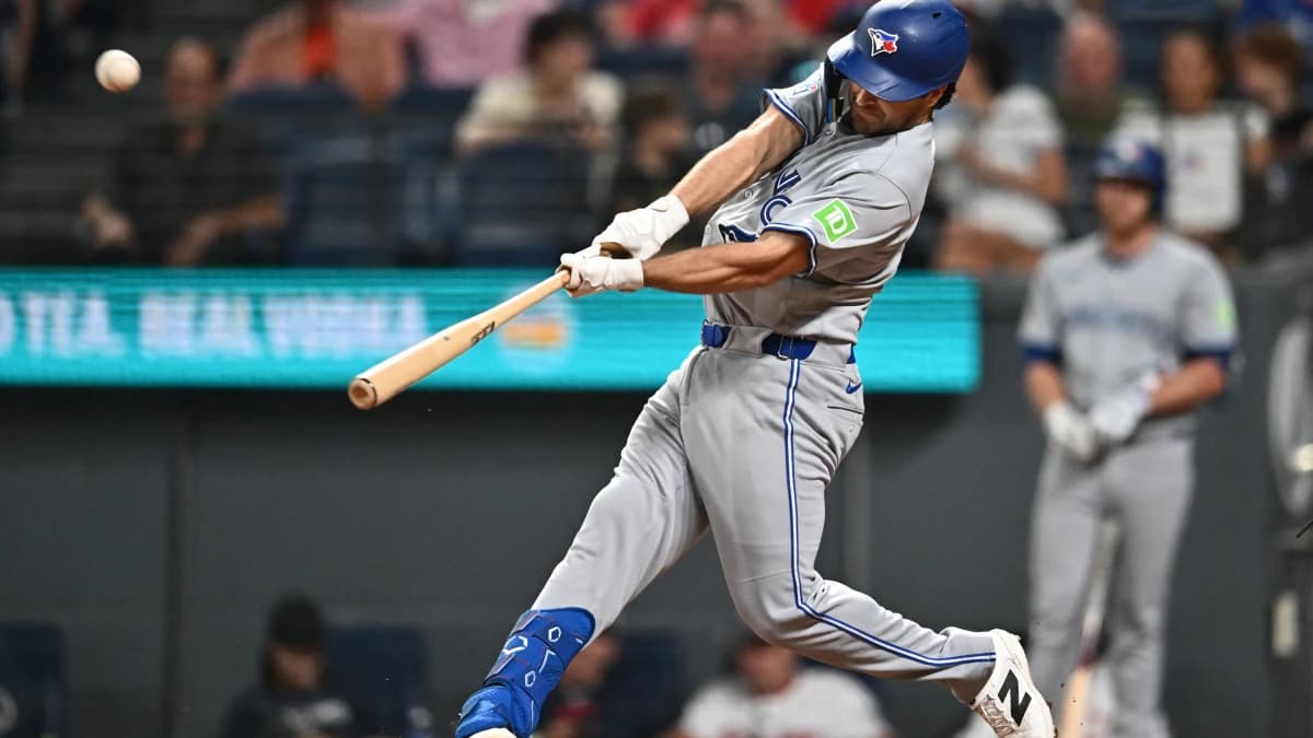 Toronto Blue Jays second baseman Josh Smith (9) hits a home run during the eighth inning against the Cleveland Guardians at Progressive Field.