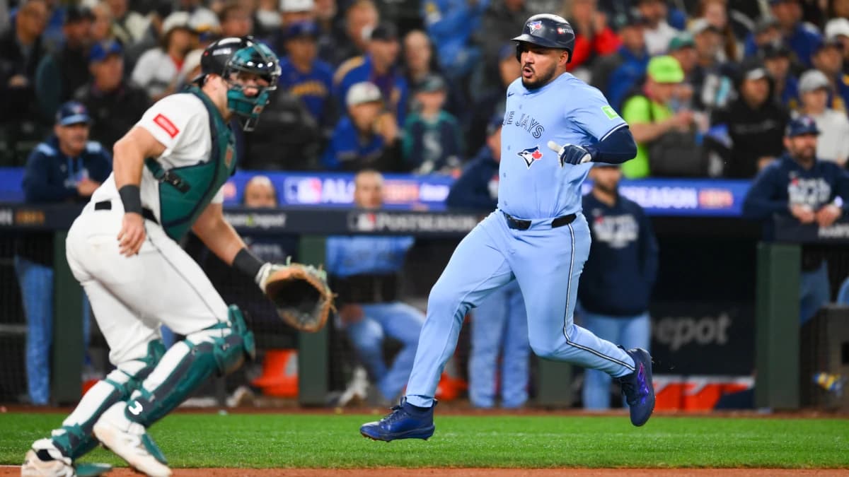 Toronto Blue Jays right fielder Anthony Santander (25) scores on a single from Toronto Blue Jays second baseman Ernie Clement (22) (not pictured) during the fifth inning against the Seattle Mariners during game three of the ALCS round for the 2025 MLB playoffs at T-Mobile Park