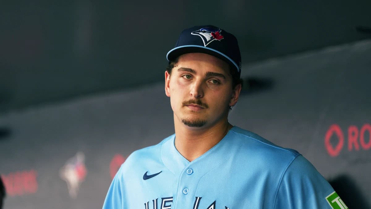 Toronto Blue Jays relief pitcher Ricky Tiedemann (33) stands in the dugout against the New York Yankees during the third inning at Rogers Centre.